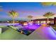 Luxury pool with fire pit and spa; surrounding patio features ambient lighting at 4160 W Ford Ave, Las Vegas, NV 89139