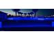 Night view of the pool and patio with blue lighting at 4160 W Ford Ave, Las Vegas, NV 89139