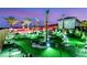 Night view of the putting green with ambient lighting at 4160 W Ford Ave, Las Vegas, NV 89139