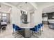 Modern wet bar with gray countertop and blue velvet stools at 4160 W Ford Ave, Las Vegas, NV 89139
