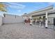 Spacious backyard area with gravel, perfect for entertaining and outdoor activities at 713 Antelope Way, Las Vegas, NV 89145