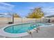 Backyard pool with clear blue water, surrounded by concrete, and secured with black metal fencing at 713 Antelope Way, Las Vegas, NV 89145