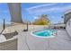 Private backyard pool with lounge seating, mature trees, and privacy fencing for serene enjoyment at 713 Antelope Way, Las Vegas, NV 89145