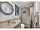 Modern bathroom features a stand-up shower and vanity with an oval mirror at 713 Antelope Way, Las Vegas, NV 89145