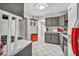 Well-lit kitchen with tile flooring and access to an exterior door at 713 Antelope Way, Las Vegas, NV 89145