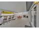 Spacious backyard area with a table, chairs, barstools and barbeque grill, ideal for entertaining at 713 Antelope Way, Las Vegas, NV 89145
