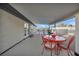 Outdoor patio featuring a dining area with red table and chairs, perfect for relaxing and entertaining guests at 713 Antelope Way, Las Vegas, NV 89145