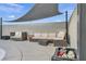 Outdoor pool patio featuring a large shade cover, modern patio seating, and block wall providing privacy at 713 Antelope Way, Las Vegas, NV 89145