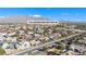 Wide aerial view of house and surrounding neighborhood at 7301 Bachelors Button Dr, Las Vegas, NV 89131