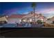 Single-story home with terracotta tile roof and desert landscaping at 7301 Bachelors Button Dr, Las Vegas, NV 89131