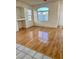 Living room with hardwood floors and large window at 7728 White Flower Ct, Las Vegas, NV 89131