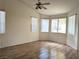 Bright bedroom with vaulted ceilings, wood floors, and multiple windows at 9728 Echo Hills Dr, Las Vegas, NV 89134