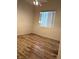 Bedroom with wood flooring and window; simple and spacious for comfort at 9728 Echo Hills Dr, Las Vegas, NV 89134
