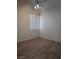 Bedroom featuring a ceiling fan, wood flooring and window for natural light at 9728 Echo Hills Dr, Las Vegas, NV 89134