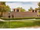 The Trails Community Center boasts a brick facade, manicured lawns, and a welcoming atmosphere at 9728 Echo Hills Dr, Las Vegas, NV 89134