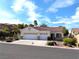 Traditional one story home with a two car garage, concrete driveway and low maintenance yard at 9728 Echo Hills Dr, Las Vegas, NV 89134