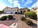 Charming single story home with a two car garage and meticulously landscaped front yard at 9728 Echo Hills Dr, Las Vegas, NV 89134