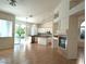 Open-concept living space featuring tile floors, a fireplace, and sliding glass doors to the backyard at 9728 Echo Hills Dr, Las Vegas, NV 89134