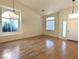 Inviting living room with beautiful floors, modern lighting, arched windows and neutral color palette at 9728 Echo Hills Dr, Las Vegas, NV 89134