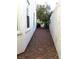 Side yard with gravel, stepping stones, and space for gardening or storage at 9728 Echo Hills Dr, Las Vegas, NV 89134