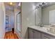 Clean bathroom with a vanity, shower, and hardwood floors at 1818 Waldman Ave, Las Vegas, NV 89102