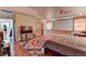 Large bedroom with a large bed, projection screen, and hardwood floors at 1818 Waldman Ave, Las Vegas, NV 89102
