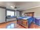 Spacious bedroom with hardwood floors, a window seat, and a large bed at 1818 Waldman Ave, Las Vegas, NV 89102