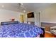 Spacious Primary bedroom with large bed, TV, and ceiling fan at 1818 Waldman Ave, Las Vegas, NV 89102
