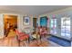Dining area with glass table, four chairs, and access to backyard at 1818 Waldman Ave, Las Vegas, NV 89102