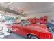 Garage with red classic car and storage shelving at 1818 Waldman Ave, Las Vegas, NV 89102