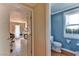 Convenient half bath with modern fixtures and blue walls at 1818 Waldman Ave, Las Vegas, NV 89102
