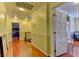 A long hallway with light yellow walls and hardwood floors at 1818 Waldman Ave, Las Vegas, NV 89102