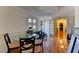 View down a hallway featuring hardwood floors and a glass-top table at 1818 Waldman Ave, Las Vegas, NV 89102