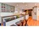 Modern kitchen features granite island, updated cabinetry, and hardwood floors at 1818 Waldman Ave, Las Vegas, NV 89102