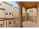 Outdoor balcony offers neighborhood views, with decorative arches, railing, and stucco walls at 6485 Arrow Cottage Ct, Las Vegas, NV 89130