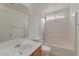 Clean bathroom with a shower-over-tub, white tiling, and ample lighting at 6485 Arrow Cottage Ct, Las Vegas, NV 89130