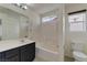 Bright bathroom featuring a shower-over-tub combo and a vanity with sleek fixtures at 6485 Arrow Cottage Ct, Las Vegas, NV 89130