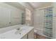 Cozy bathroom with tiled floors and a combined tub and shower at 6485 Arrow Cottage Ct, Las Vegas, NV 89130