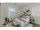 Airy bedroom with ample natural light and stylish, minimalist decor at 6485 Arrow Cottage Ct, Las Vegas, NV 89130