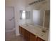 Double vanity bathroom with large mirror and access to shower at 1113 Cloudy Day Dr, Henderson, NV 89074