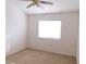 Well-lit bedroom with neutral walls and carpeted floor at 1113 Cloudy Day Dr, Henderson, NV 89074