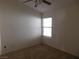 Bright bedroom featuring a ceiling fan and carpeted floor at 1113 Cloudy Day Dr, Henderson, NV 89074