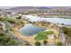 Scenic aerial view of golf course, lake, and waterfront properties in a gated community at 19 Rue Grimaldi Way, Henderson, NV 89011