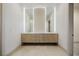 Modern bathroom vanity with dual sinks, custom wood cabinets, and sleek lighting at 19 Rue Grimaldi Way, Henderson, NV 89011