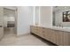 Elegant bathroom vanity with dual sinks and modern lighting at 19 Rue Grimaldi Way, Henderson, NV 89011