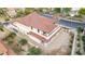 Beige two-story house with a terracotta tile roof and a gravel yard at 19 Rue Grimaldi Way, Henderson, NV 89011