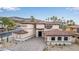 Stunning exterior of a home with stone and stucco accents, a paver driveway, and a charming courtyard entrance at 19 Rue Grimaldi Way, Henderson, NV 89011