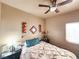 Cozy bedroom with a comfortable bed and ceiling fan at 3340 N Campbell Rd, Las Vegas, NV 89129