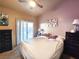 Main bedroom with king-size bed and private access to patio at 3340 N Campbell Rd, Las Vegas, NV 89129