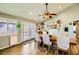 Dining room with farmhouse table and access to backyard at 3698 Rawhide Ct, Las Vegas, NV 89120